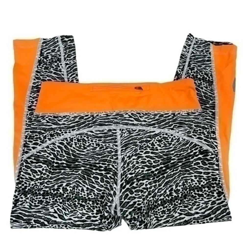Nike Dri-Fit Women Cropped Leggings Medium | Black White Orange